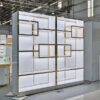 luxury jewelry wall display cabinet with gold frame and LED lighting for retail showroom