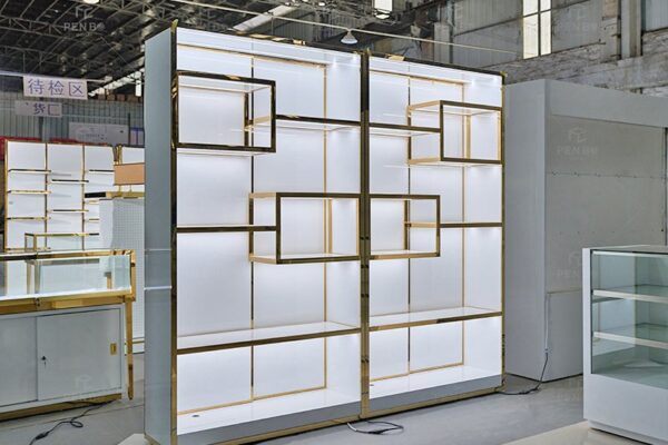 luxury jewelry wall display cabinet with gold frame and LED lighting for retail showroom