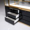 glass jewelry showcase for retail stores with gold frame and black bas