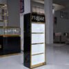 glass jewelry showcase for retail stores with gold frame and black bas