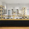 small jewelry store design, glass jewelry showcase for retail stores with gold frame and black bas