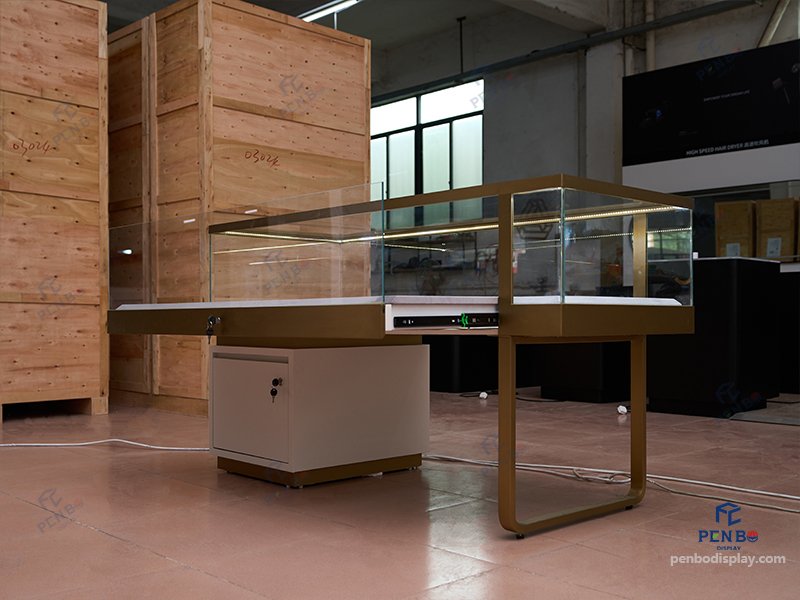 custom glass jewelry display counter with gold frame and storage cabinet
