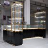 glass jewelry showcase for retail stores with gold frame and black bas