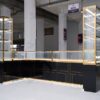 glass jewelry showcase for retail stores with gold frame and black bas