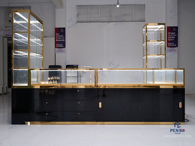 glass jewelry showcase for retail stores with gold frame and black bas