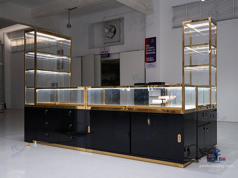 glass jewelry showcase for retail stores with gold frame and black bas