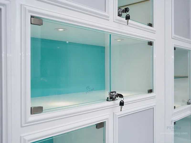 Wall-mounted jewelry display cabinets with lockable glass boxes and LED logo signage