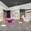High-end boutique design with golden clothing racks and jewelry showcases
