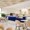 Custom coffee bar counter with blue finish for modern café interior