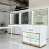 White and gold optical store glass display cabinet with built-in LED shelving and lockable storage drawers