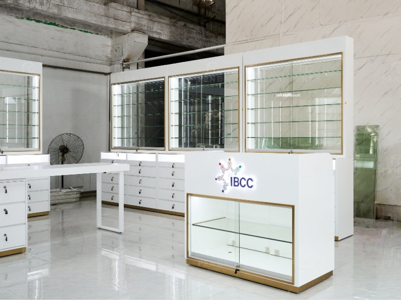 White and gold optical store glass display cabinet with built-in LED shelving and lockable storage drawers