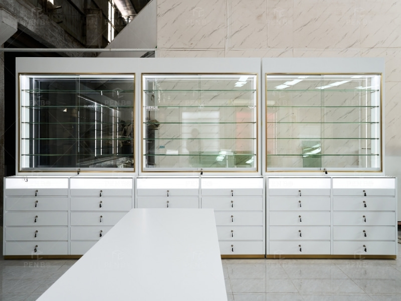 White and gold optical store glass display cabinet with built-in LED shelving and lockable storage drawers