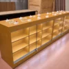 Wooden mobile phone display table with security holders for a cell phone store