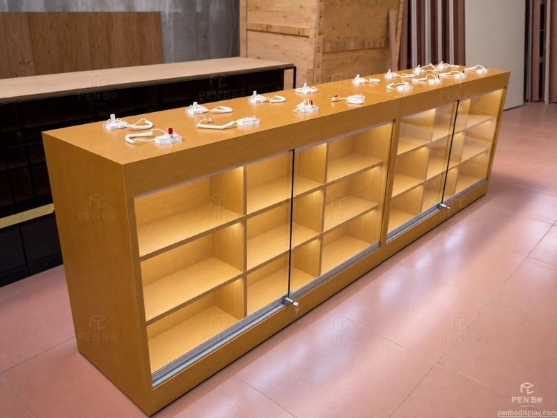 Wooden mobile phone display table with security holders for a cell phone store