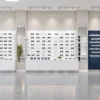 Optical store design rendering with white eyewear display shelves, storage cabinets and blue accent panels